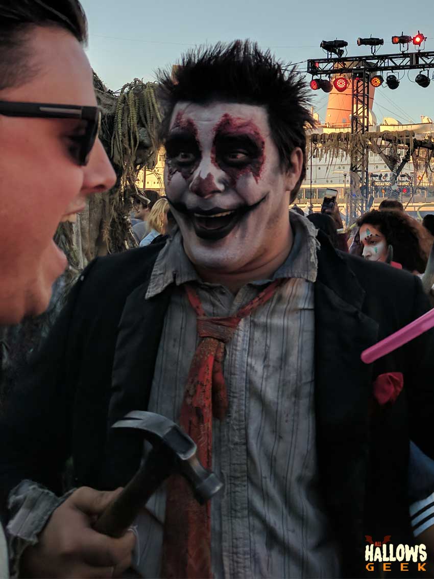 A deranged monster from The Queen Mary's Dark Harbor wielding a hammer
