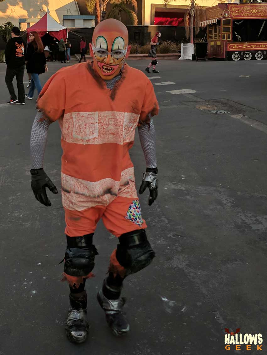 An orange clown-like monster with fangs at The Queen Mary's Dark Harbor