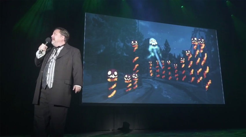 Jeff Tucker with concept art of Timber Mountain Log Ride