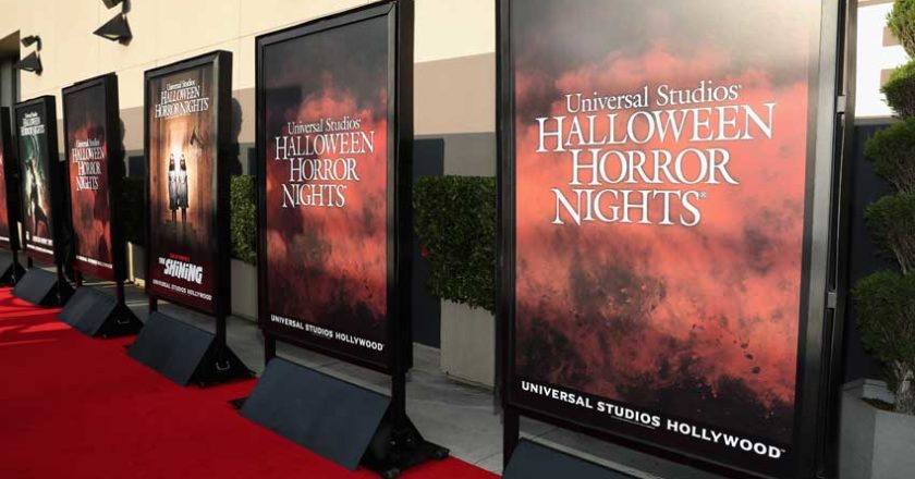 Halloween Horror Nights posters along the red carpet