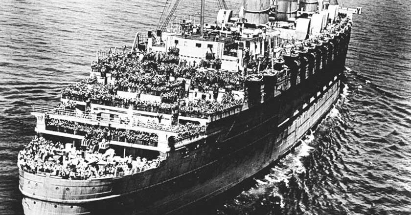 Black and white photo of the Queen Mary at sea