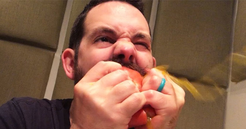 Foley artist Matt Davies bites into a tomato to make the sound of a zombie bite