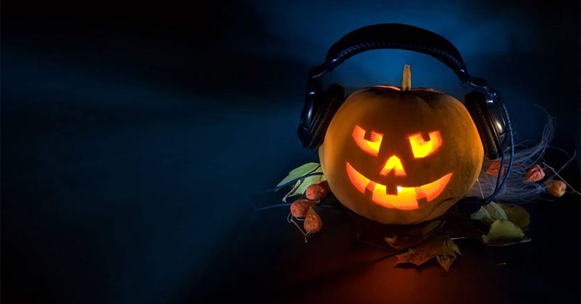 Jack-'O-lantern wearing headphones