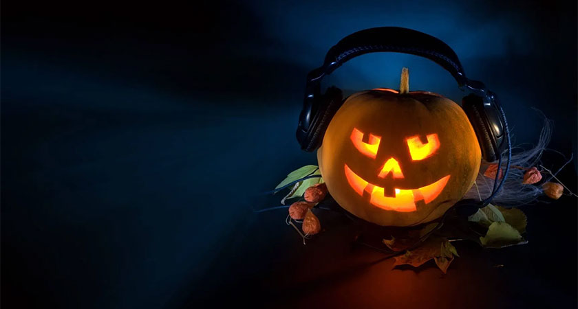 Jack-'O-lantern wearing headphones