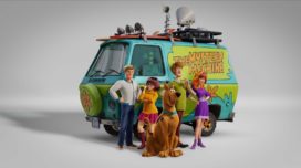 Fred, Velma, Scooby-Doo, Shaggy, and Daphne in front of the Mystery Machine