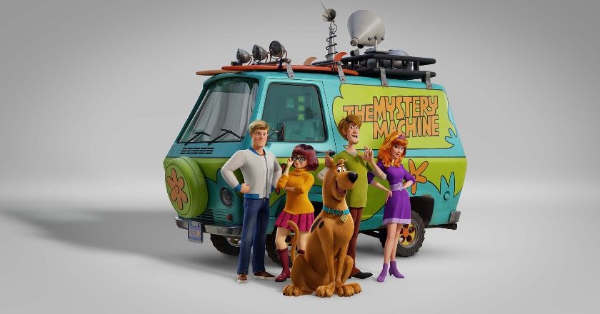 Fred, Velma, Scooby-Doo, Shaggy, and Daphne in front of the Mystery Machine