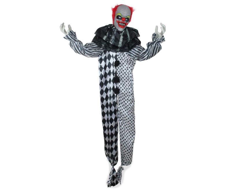 Animated clown in a black and white checkered and polka dot jumpsuit