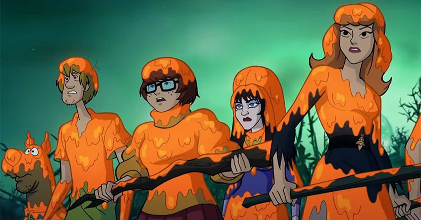 Scooby, Shaggy, Velma, Elvira, and Daphne covered in pumpkin guts.