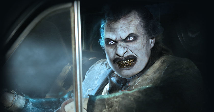 A ghoul driving a car