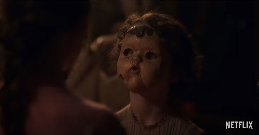 A child wearing a creepy doll face in The Haunting of Bly Manor