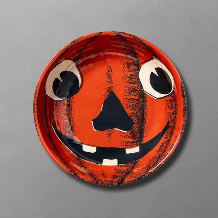 Pumpkin candy bowl featuring a 19th century-inspired drawing of a jack-o'-lantern