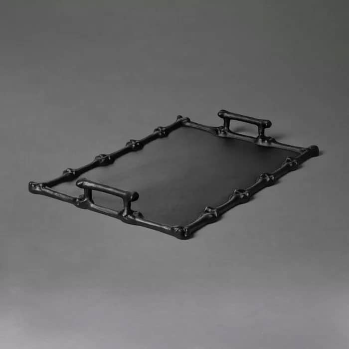 Black metal serving with bone detailing around the edges.