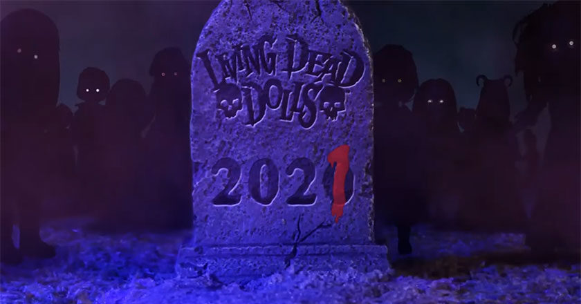 Tombstone that reads Living Dead Dolls 2020 with the last zero with a 1 written in blood over it.