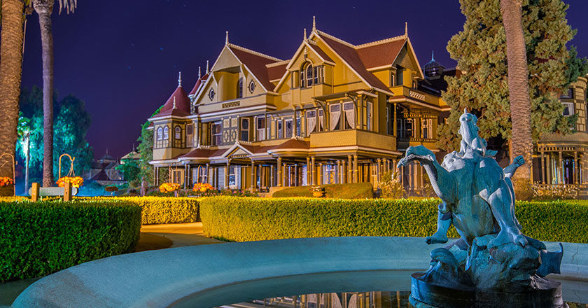 The front of the Winchester Mystery House at night