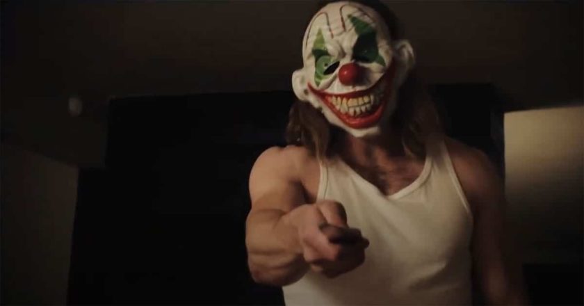 Killer wielding a knife in a clown mask