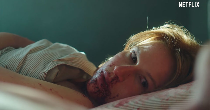 Thorborg Johansen as Live lays in a bed covered in blood in a scene from "Post Mortem."