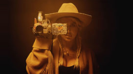 Kesha holding a camcorder