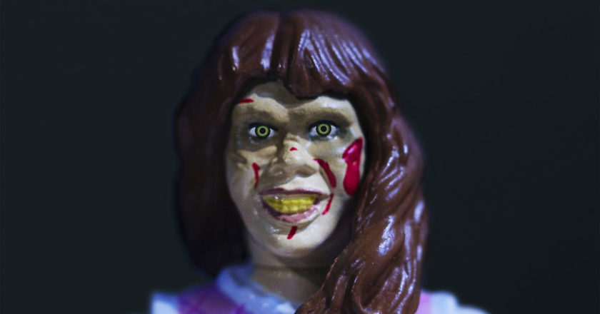 Closeup of the face on the Regan MacNeil ReAction figure from Super7