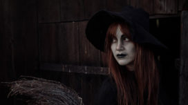 Young girl dressed as a witch