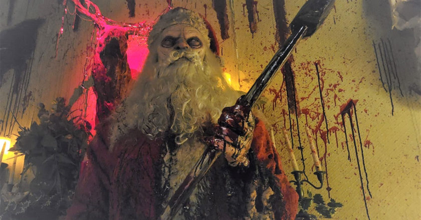 Blood covered Santa holding a spear at Reign of Terror's Ho-Ho-HORROR