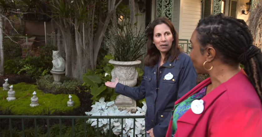 Disneyland Resort host, Mia, and Disney Imagineer, Michele Hobbs walking through the pet cemetery at Disneyland's Haunted Mansion