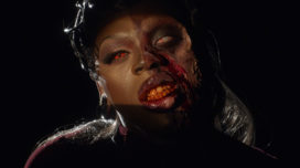 SAINT in monster makeup for the "Halfway There (Half-O-Ween) music video.