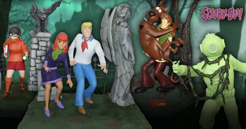Velma, Daphne and Fred, Scooby and Shaggy, and Captain Cutler statues