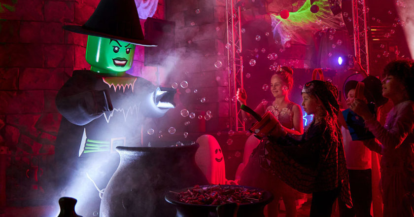 A LEGO witch greets kids at LEGOLAND's Monster Party