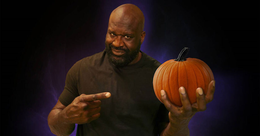 Shaquille O’Neal holding a pumpkin