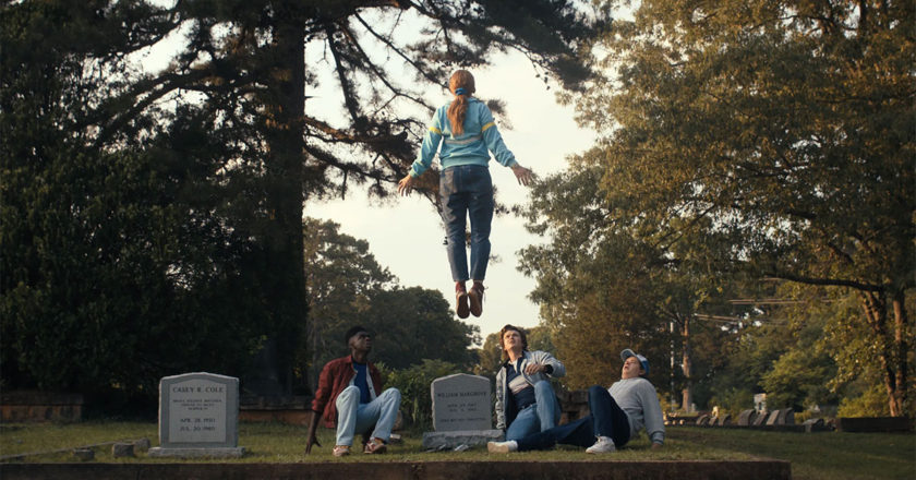 Max floats above her brother's grave while under the control of Vecna in "Stranger Things 4."