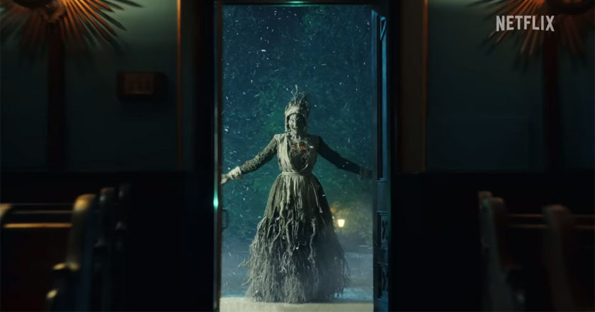 A witch stands in a doorway in image from the trailer from Guillermo Del Toro's Cabinet of Curiosities