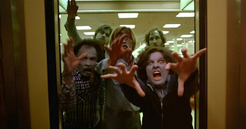 A group of zombies reach through a door in "Dawn of the Dead"