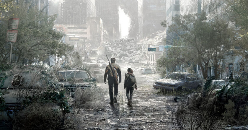 Joel and Ellie walk down a post-apocalyptic street in key art for HBO's "The Last Of Us"