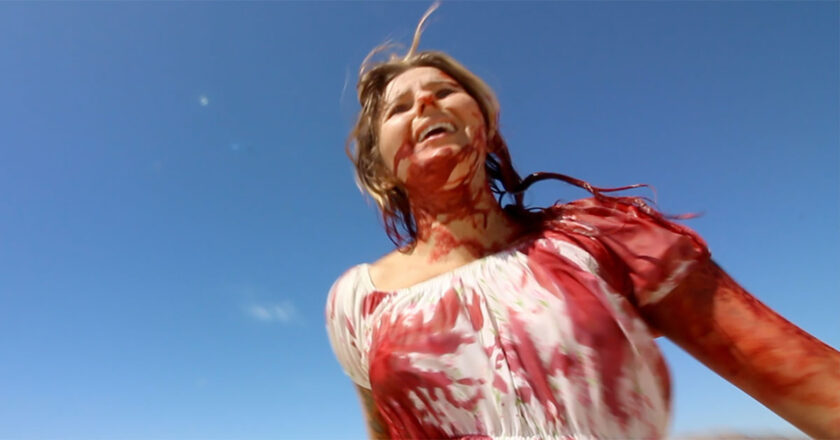 Michelle May covered in blood in "The Outwaters"