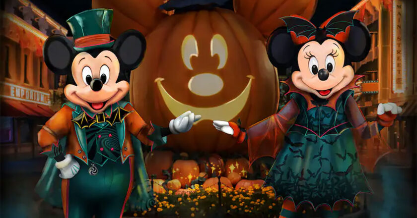 A concept image of Mickey and Minnie in their 2023 Halloween costumes in front of a jack-o-lantern Mickey