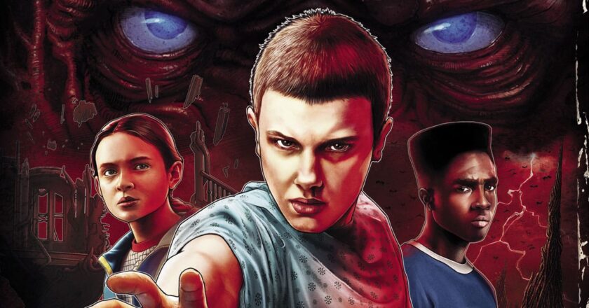 The eyes of Vecna look upon Max, Eleven, and Lucas on the cover of "Stranger Things: Heroes and Monsters