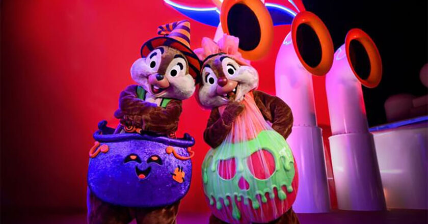 Chip and Dale dressed up like a witch and a poison apple on the Disney Cruise Line