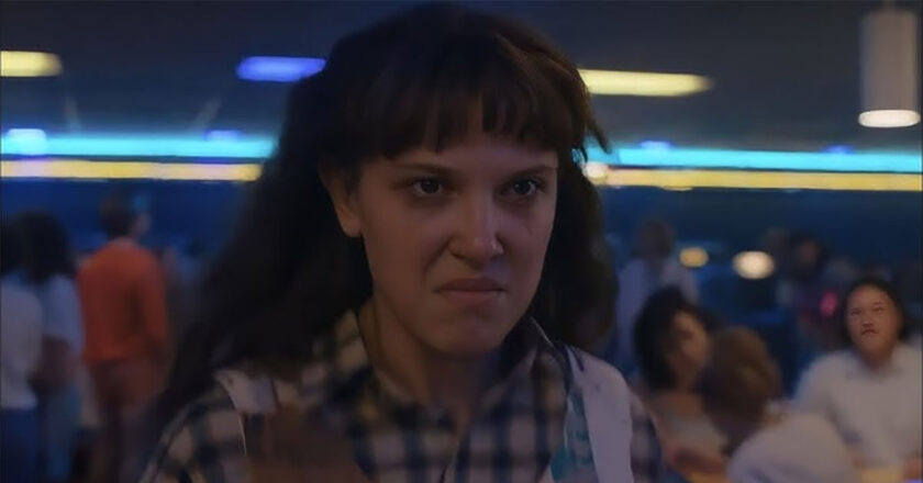 Eleven walks angrily through the Rink-O-Mania in Stranger Things 4