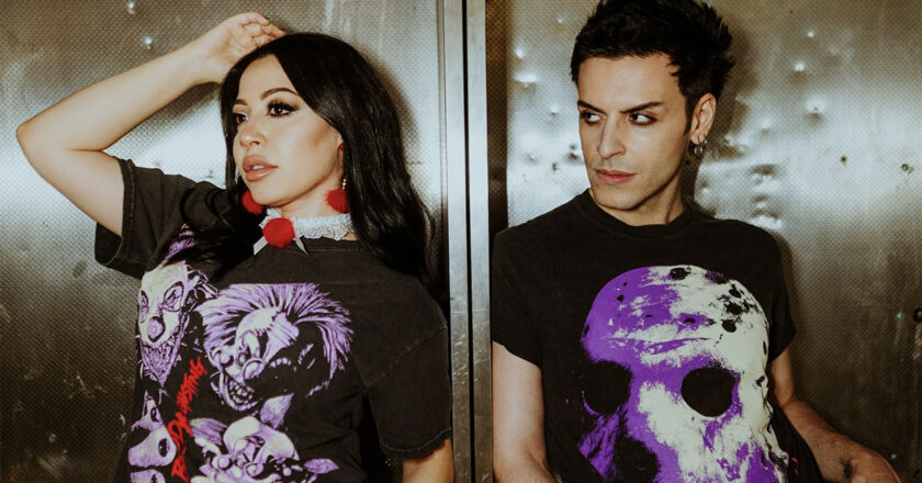 A female model wearning a Bloody Disgusting Killer Klowns From Outer Space shirt and a male model wearing a Bloody Disgusting Jason Voorhees shirt