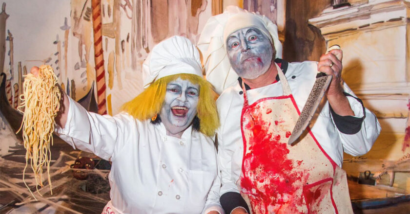 The demented chef's hold a pizza covered in body parts during the Demented Chef Side Show