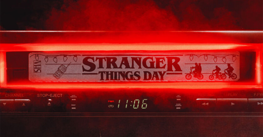 A VCR with a VHS tape in it that says Stranger Things Day