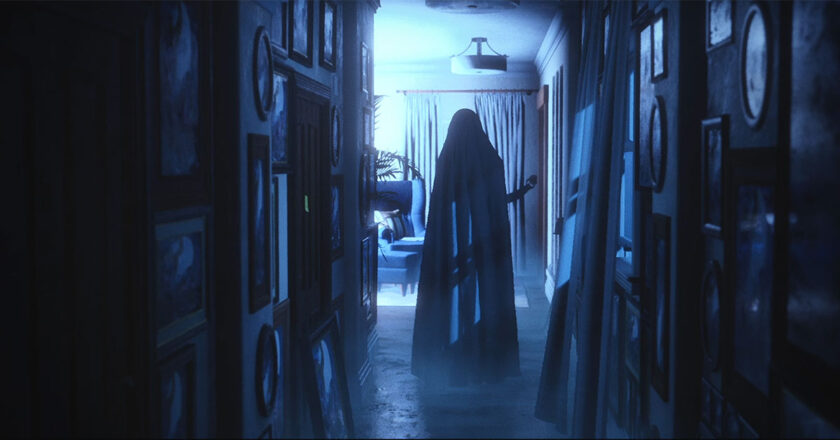 A figure covered in a white sheet stands at the end of a dark hallway in, "Luto"