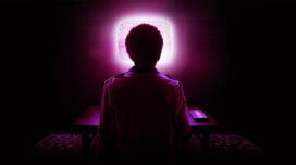 Silhouette of the back of Owen looking at a snowy TV screen from the "I Saw The TV Glow" poster