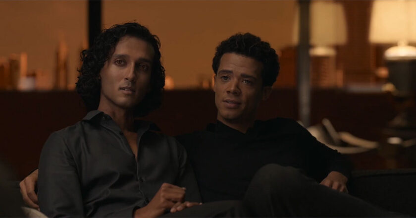 Assad Zaman as Armand and Jacob Anderson as Louis sit on a couch together in still from Interview with the Vampire.