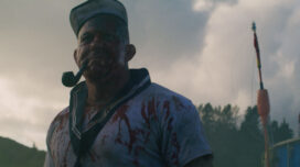 Popeye smokes a pipe while covered in blood in Popeye's Revenge