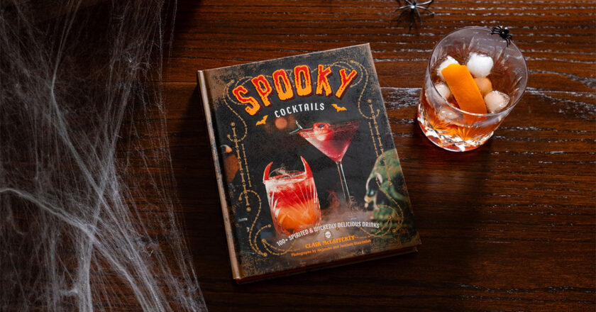 Spooky Cocktails on a table next to a drink and spiderwebs